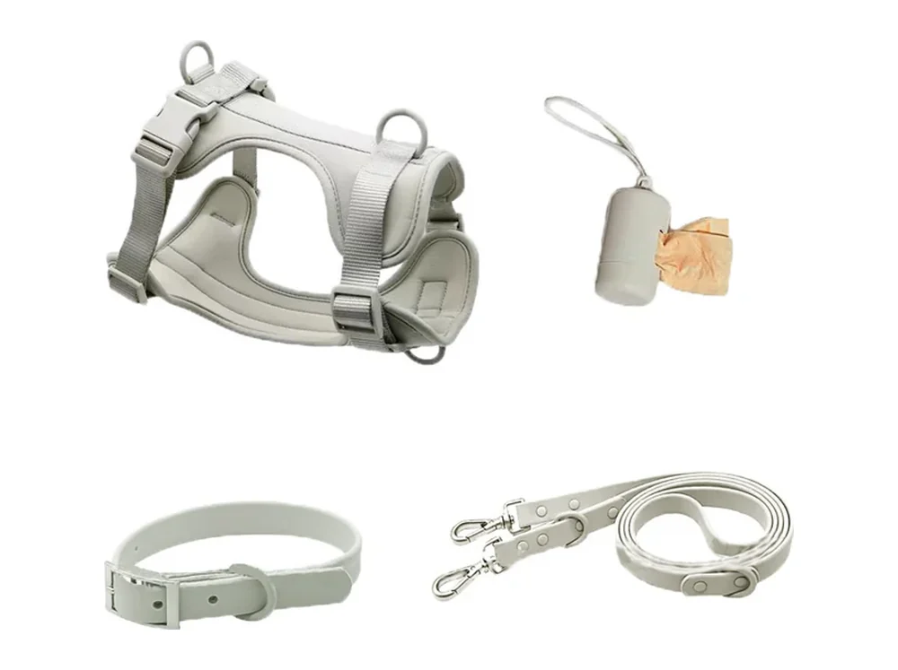 Light grey oxford harness with matching collar, leash and bag holder, laid flat