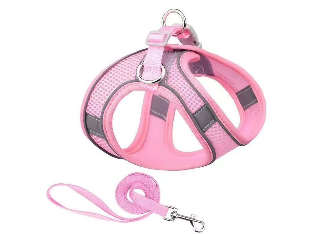 Pink and grey mesh puppy harness with a matching pink leash, laid flat